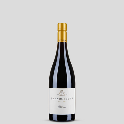 A bottle of 2013 Bannockburn Shiraz wine with a white label, displaying the brand name and the variety, against a plain background.