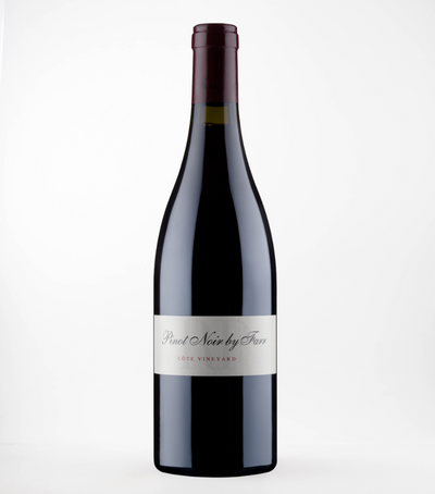 A bottle of 2021 By Farr RP Pinot Noir wine with a white label on a clear glass bottle.