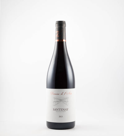 A bottle of 2023 Domaine de l'Aste Santenay Rouge wine with a white label, red wine visible at the top, and a clear glass bottle.