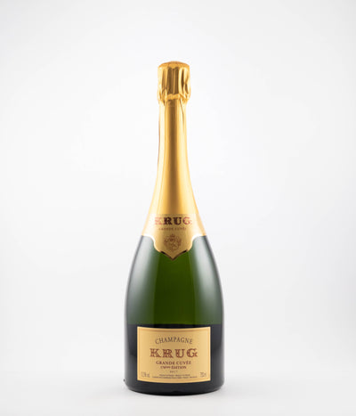 A bottle of NV Krug Grande Cuvee Edition 171st Edition Champagne with a gold foil top on a white background.