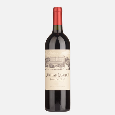 Red wine bottle with Chateau Laroque Saint Emillon label on a white background