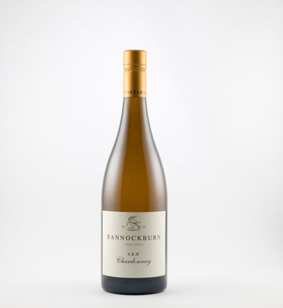 A bottle of 2023 Bannockburn S.R.H. Chardonnay wine with a white label on a plain background.